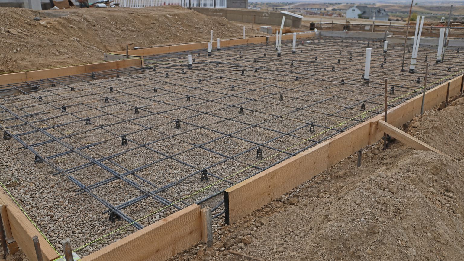 Concrete forms and rebar prep before pour on a Northern Utah residential project